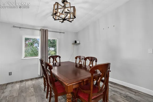 a view of a dining room with furniture window and outside view