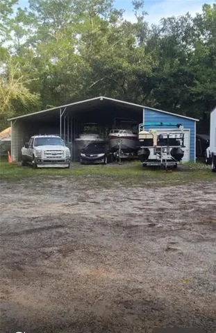 a view of a house with truck parked