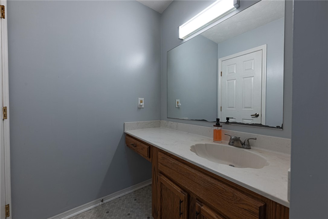 5399 Country Ridge Drive Mason, OH 45040 - Photo 23 of 29 This bathroom features a sleek vanity with a built-in sink, offering both style and practicality.