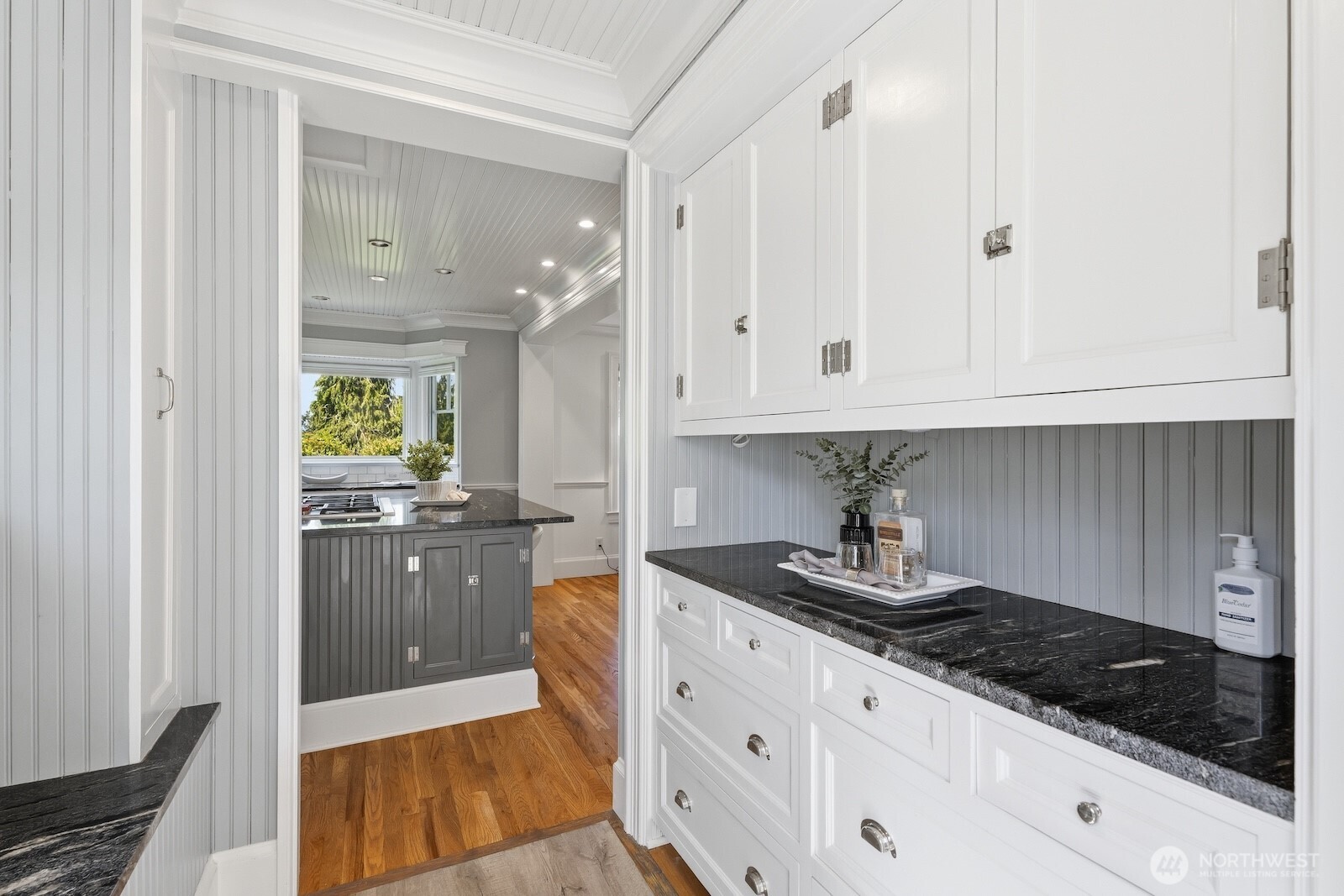 7219 Soundview Drive Edmonds, WA 98026 - Photo 11 of 40 a kitchen with granite countertop white cabinets and stainless steel appliances
