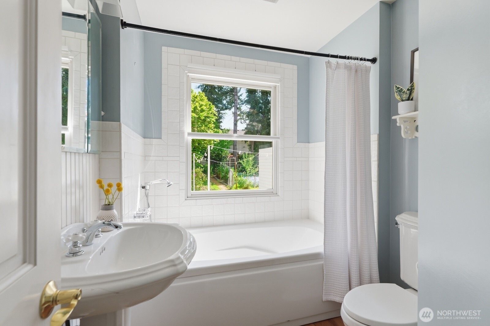 7219 Soundview Drive Edmonds, WA 98026 - Photo 14 of 40 a bathroom with a sink toilet and shower