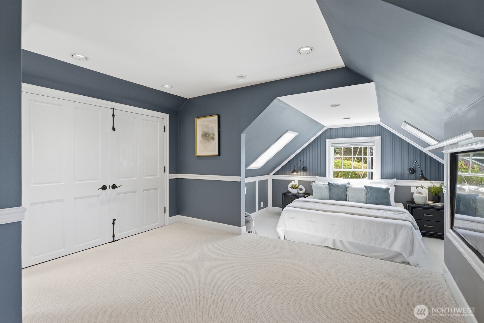 7219 Soundview Drive Edmonds, WA 98026 - Photo 17 of 40 a spacious bedroom with a large bed and a large window