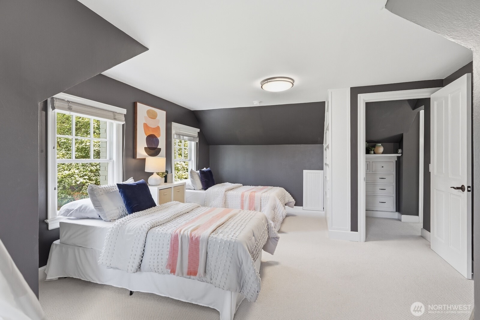 7219 Soundview Drive Edmonds, WA 98026 - Photo 22 of 40 a bedroom with a bed and a large window