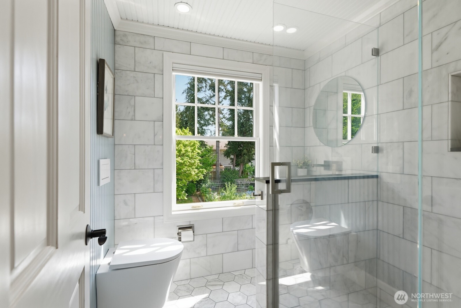 7219 Soundview Drive Edmonds, WA 98026 - Photo 23 of 40 a bathroom with a toilet a sink and shower