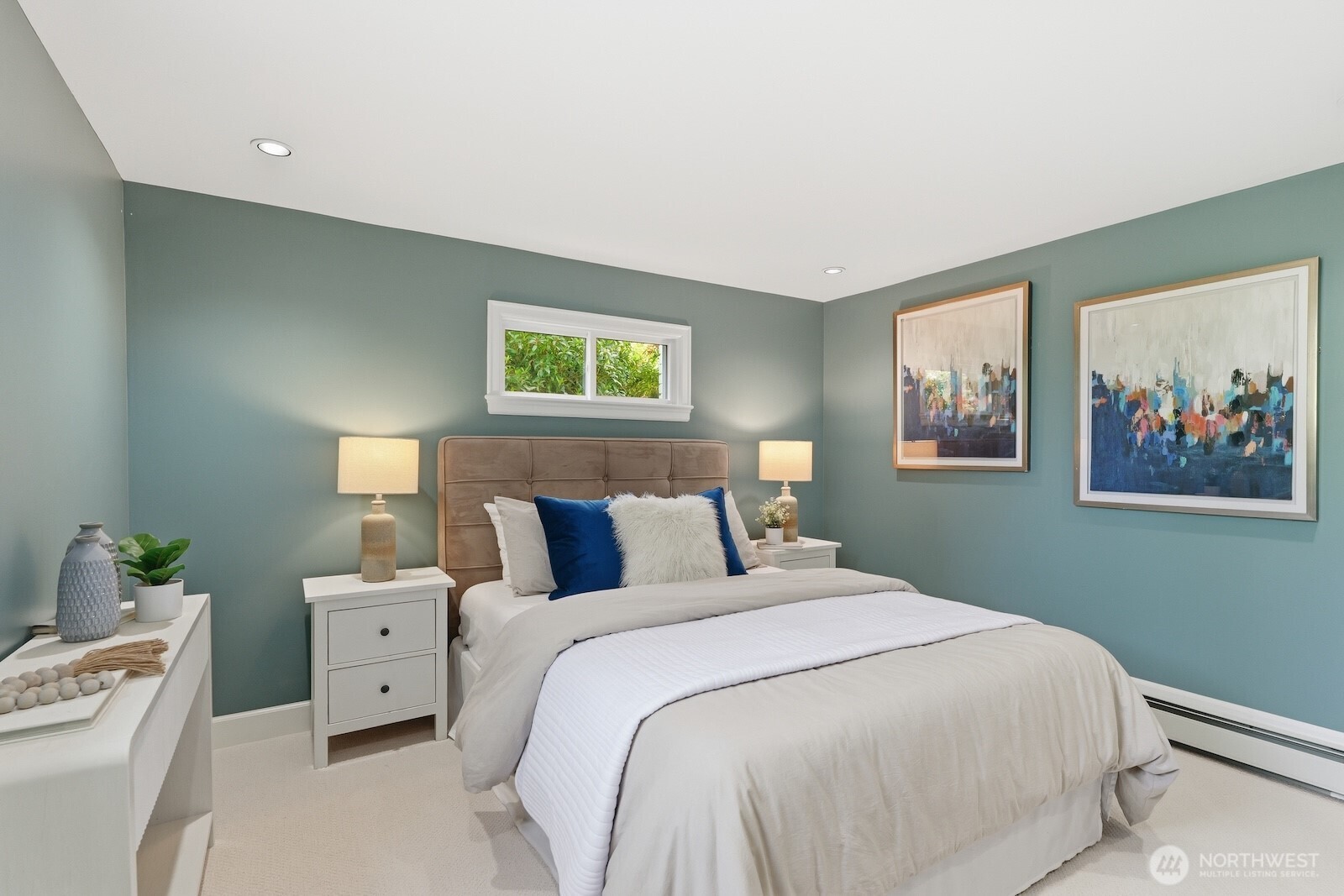 7219 Soundview Drive Edmonds, WA 98026 - Photo 24 of 40 a bedroom with a bed and a painting on the wall