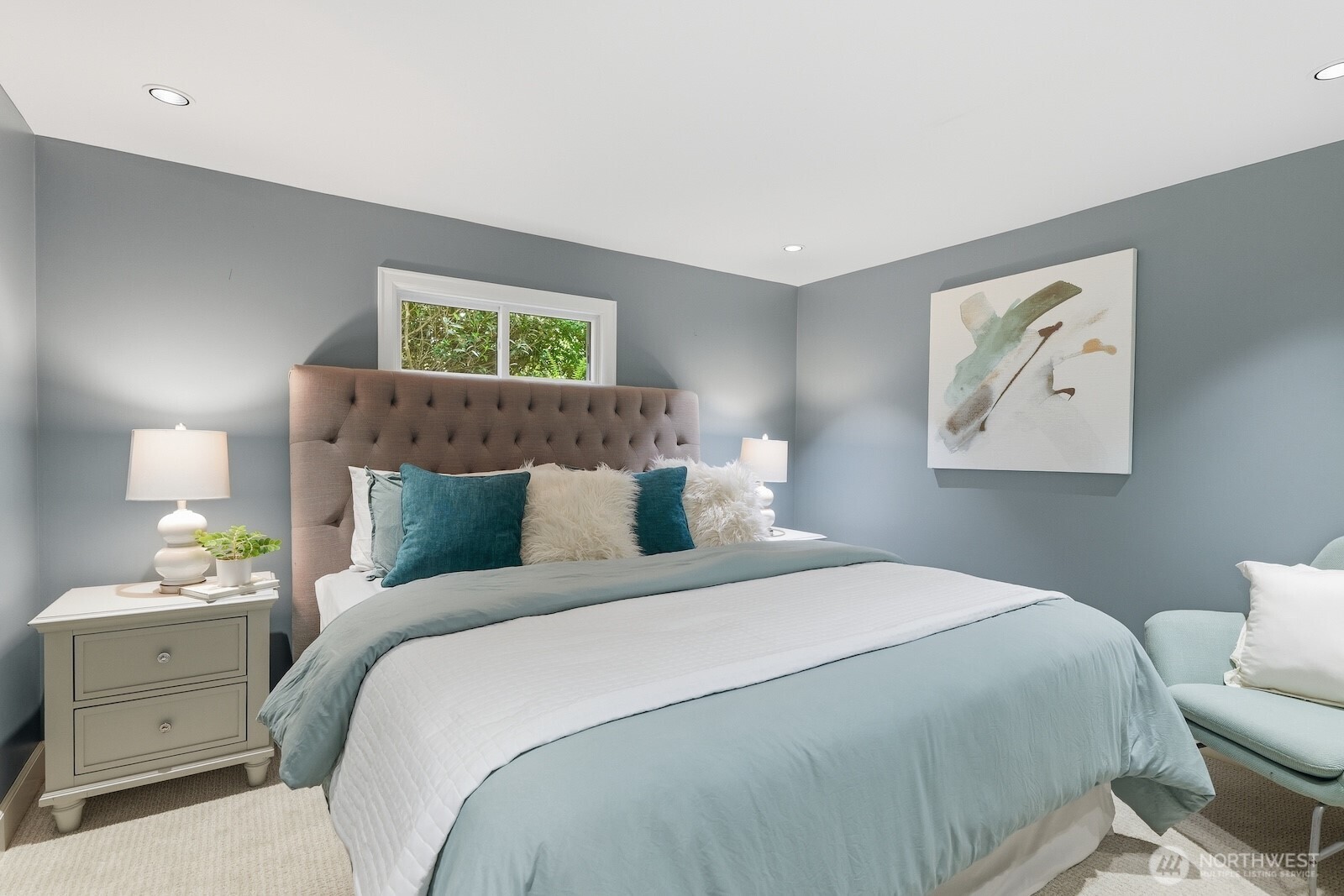 7219 Soundview Drive Edmonds, WA 98026 - Photo 26 of 40 a bedroom with a bed and a painting on the wall