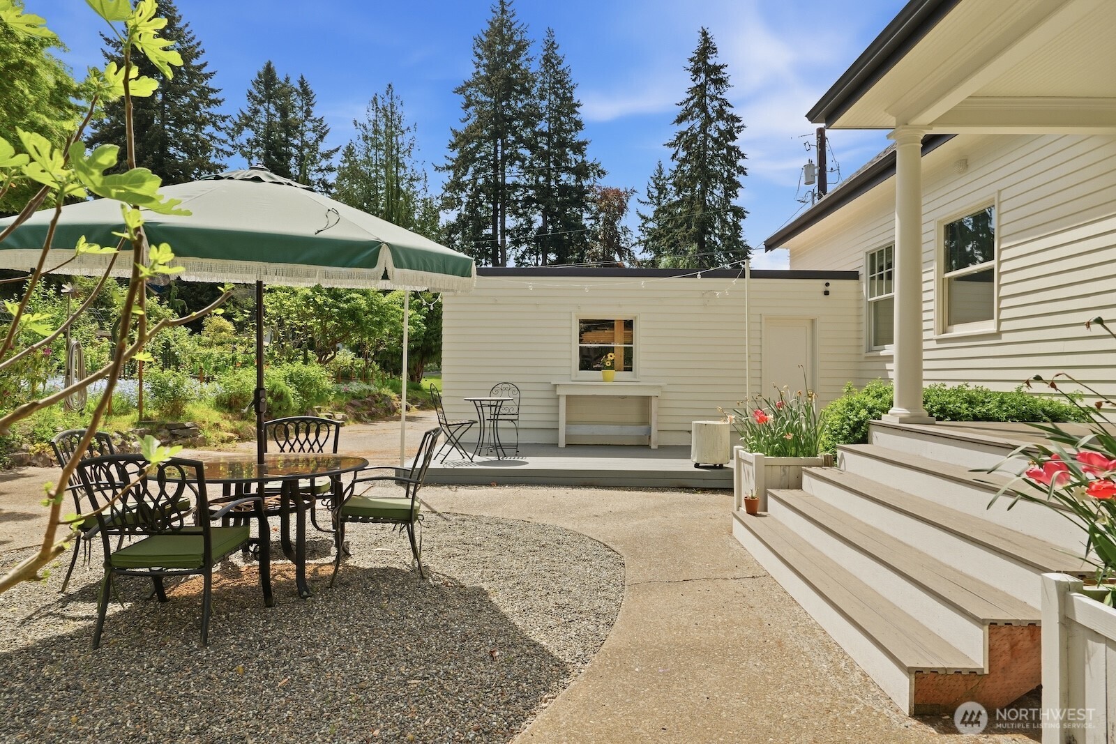 7219 Soundview Drive Edmonds, WA 98026 - Photo 30 of 40 a view of a patio with table and chairs and potted plants