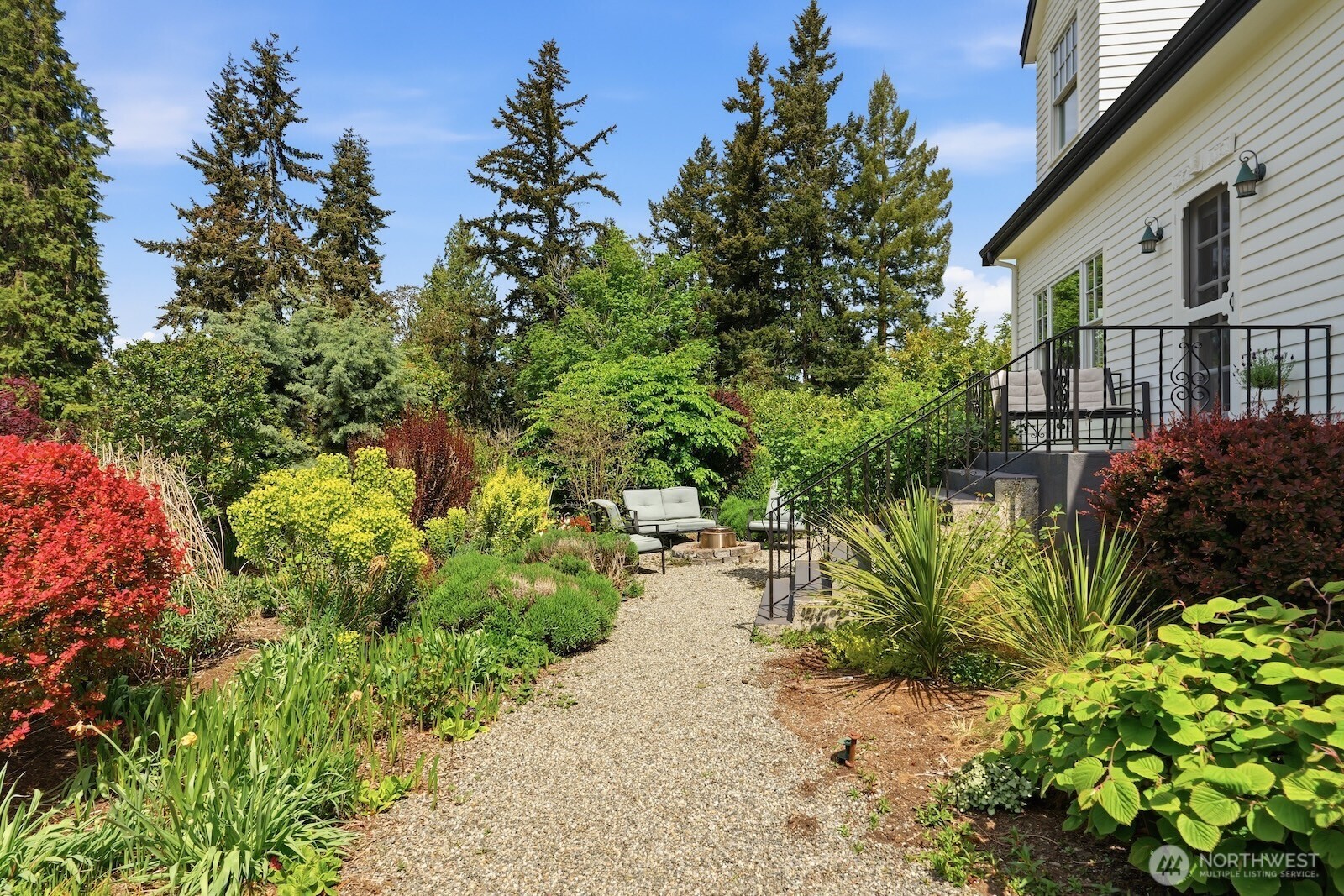 7219 Soundview Drive Edmonds, WA 98026 - Photo 3 of 40 a backyard of a house with lots of green space