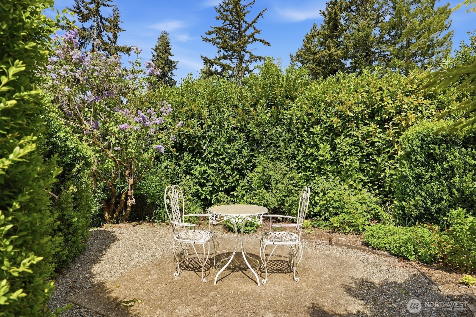 7219 Soundview Drive Edmonds, WA 98026 - Photo 34 of 40 a patio with table and chairs and potted plants