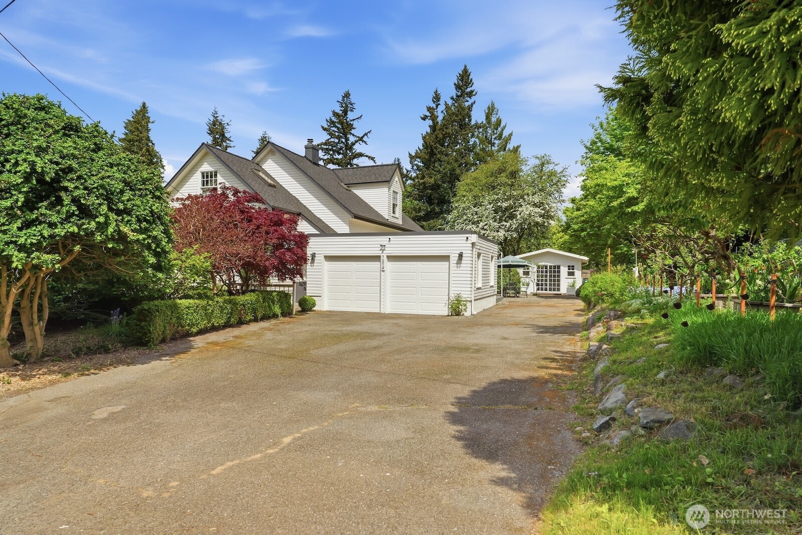 7219 Soundview Drive Edmonds, WA 98026 - Photo 38 of 40 a view of a house with a yard and garage