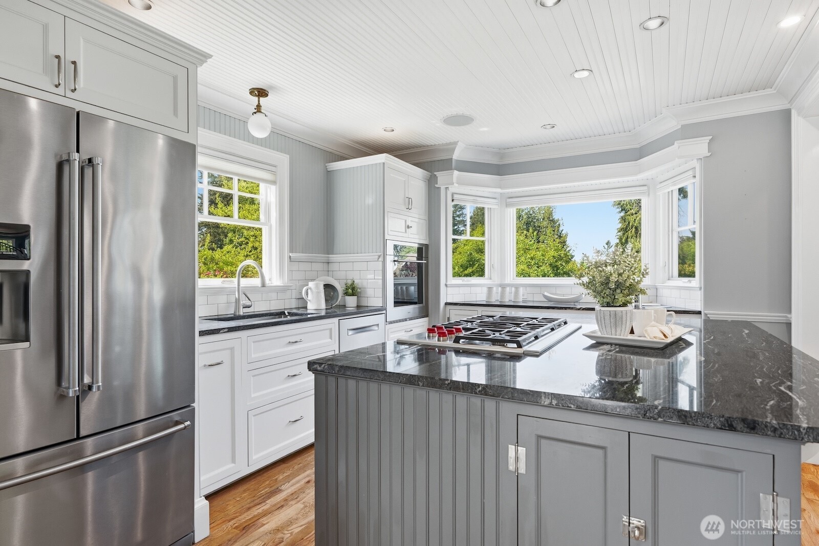 7219 Soundview Drive Edmonds, WA 98026 - Photo 9 of 40 a kitchen with a stove a refrigerator and a sink