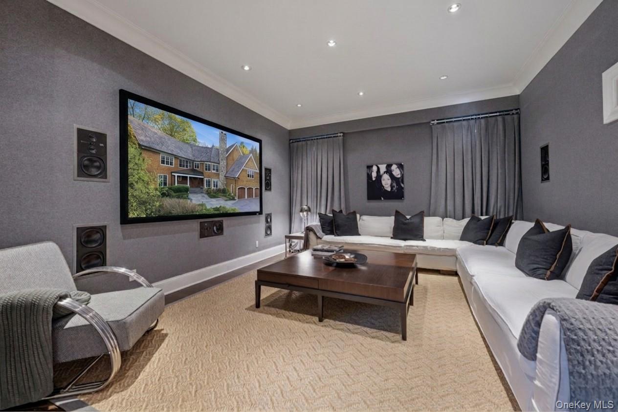 16 Wrights Mill Road Armonk, NY 10504 - Photo 11 of 49 a living room with furniture and a flat screen tv