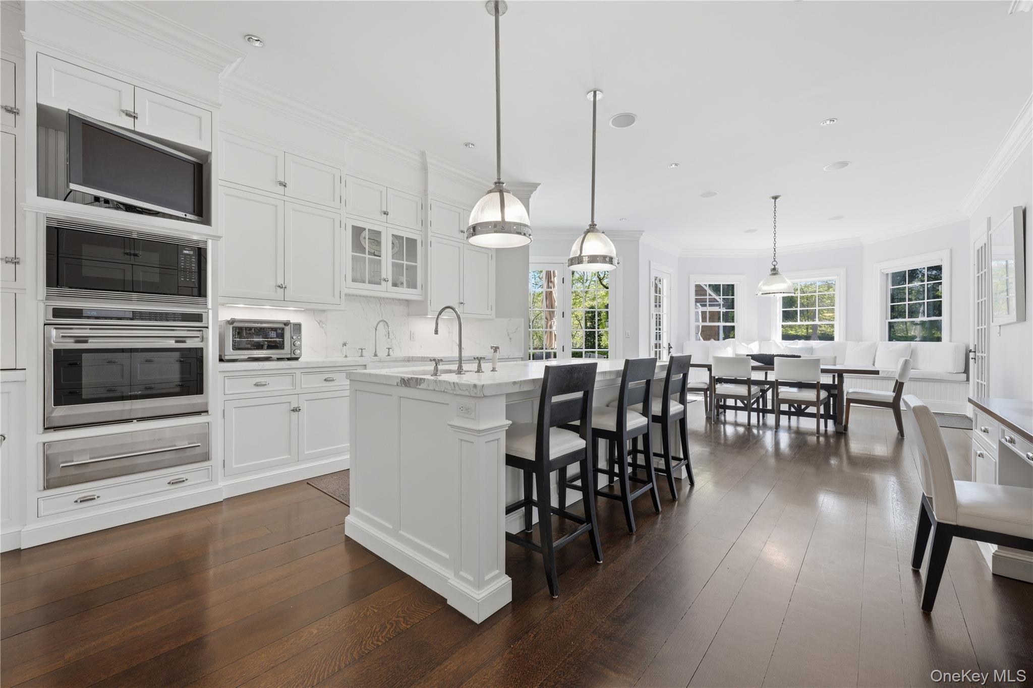 16 Wrights Mill Road Armonk, NY 10504 - Photo 16 of 49 a kitchen with stainless steel appliances granite countertop a stove a kitchen island a dining table and chairs
