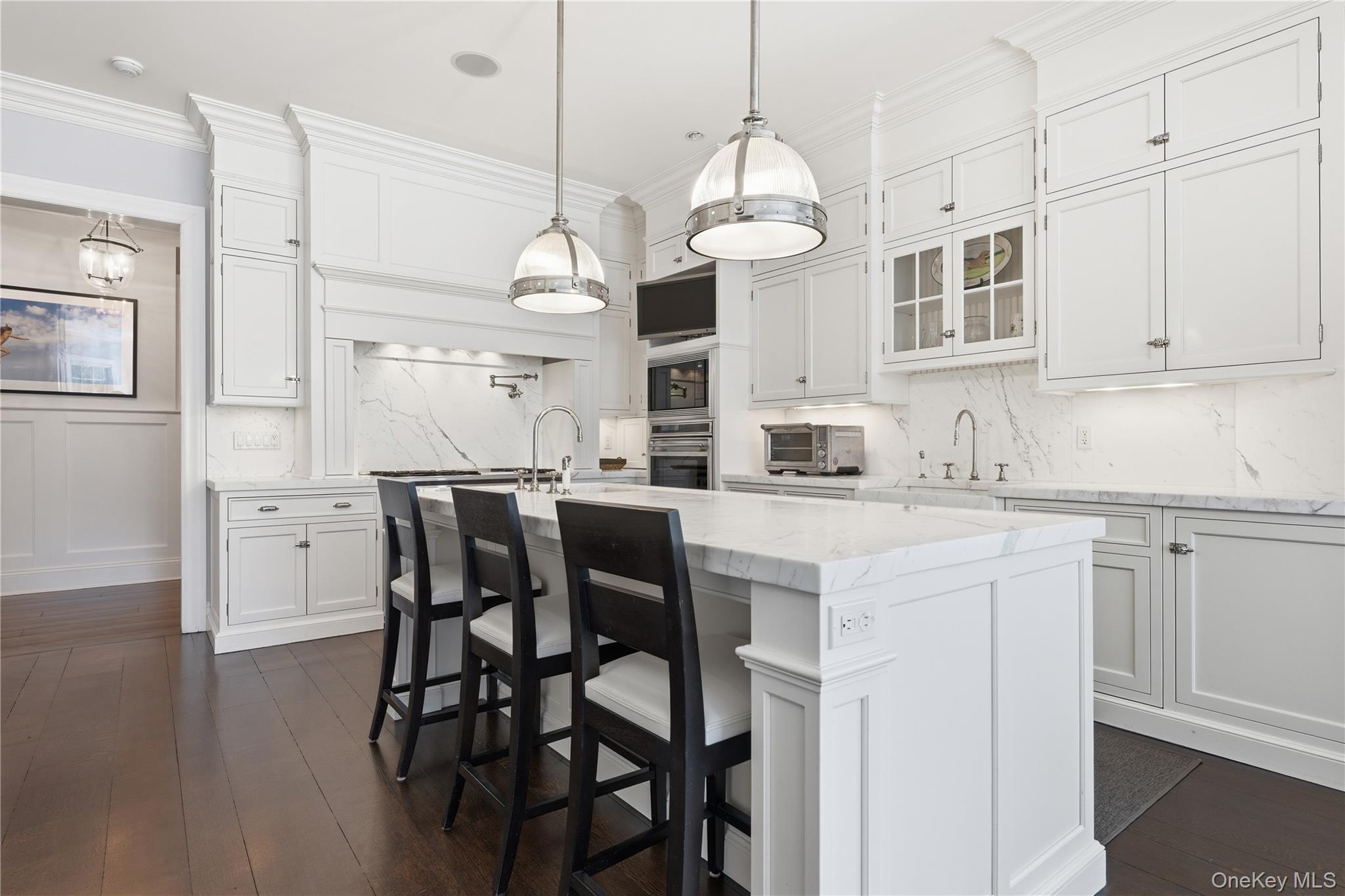 16 Wrights Mill Road Armonk, NY 10504 - Photo 17 of 49 a kitchen with stainless steel appliances kitchen island granite countertop a table chairs and white cabinets