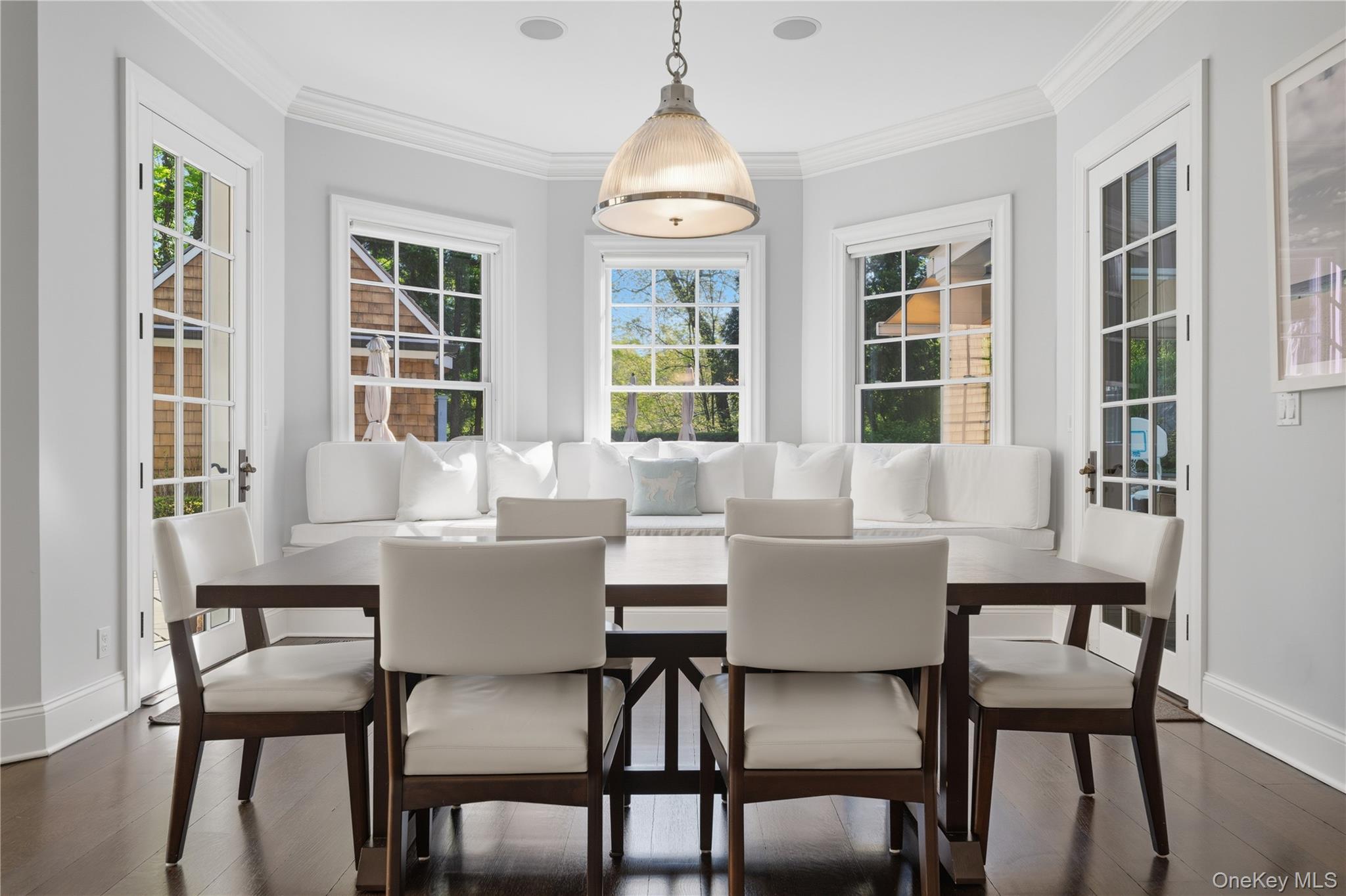 16 Wrights Mill Road Armonk, NY 10504 - Photo 19 of 49 a dining room with furniture a chandelier and wooden floor