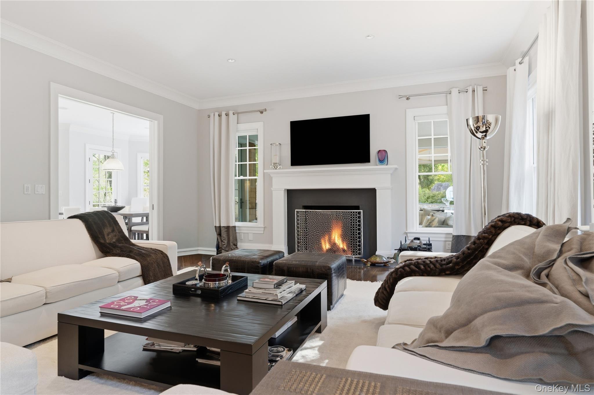 16 Wrights Mill Road Armonk, NY 10504 - Photo 22 of 49 a living room with furniture and a fireplace