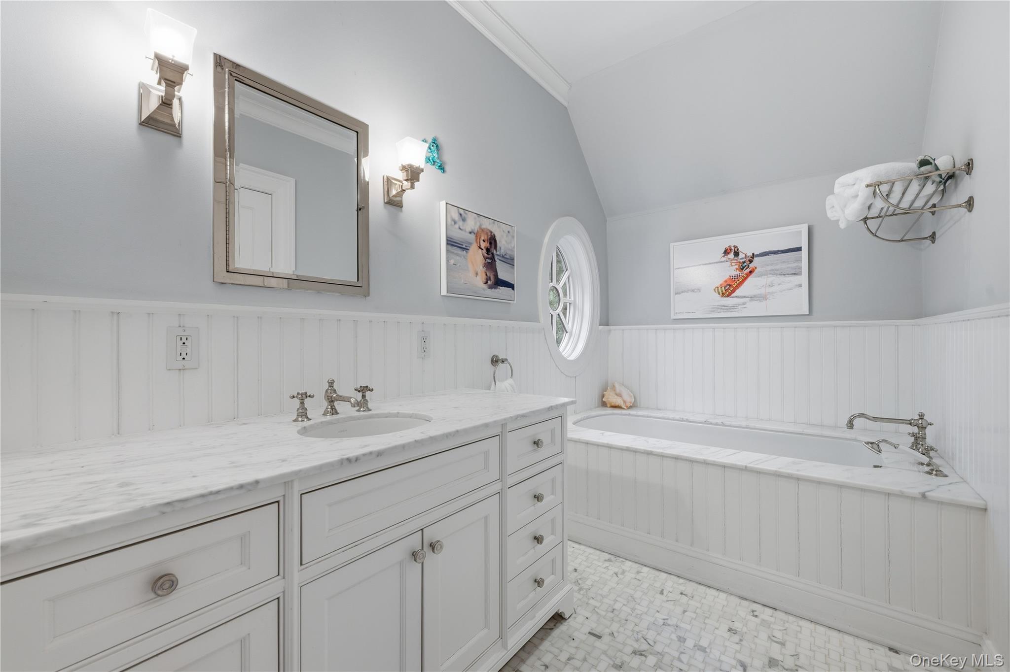 16 Wrights Mill Road Armonk, NY 10504 - Photo 28 of 49 a bathroom with a double vanity sink a mirror and a bathtub
