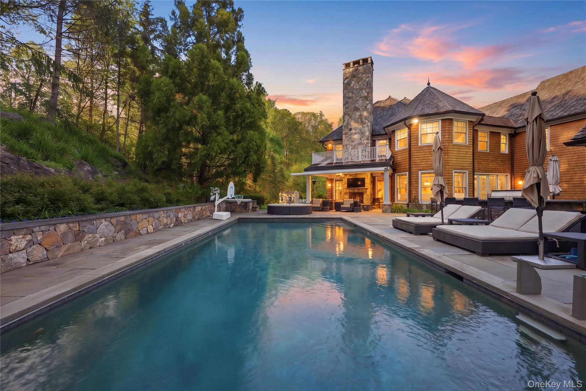 16 Wrights Mill Road Armonk, NY 10504 - Photo 3 of 49 a view of a swimming pool with a lounge chairs