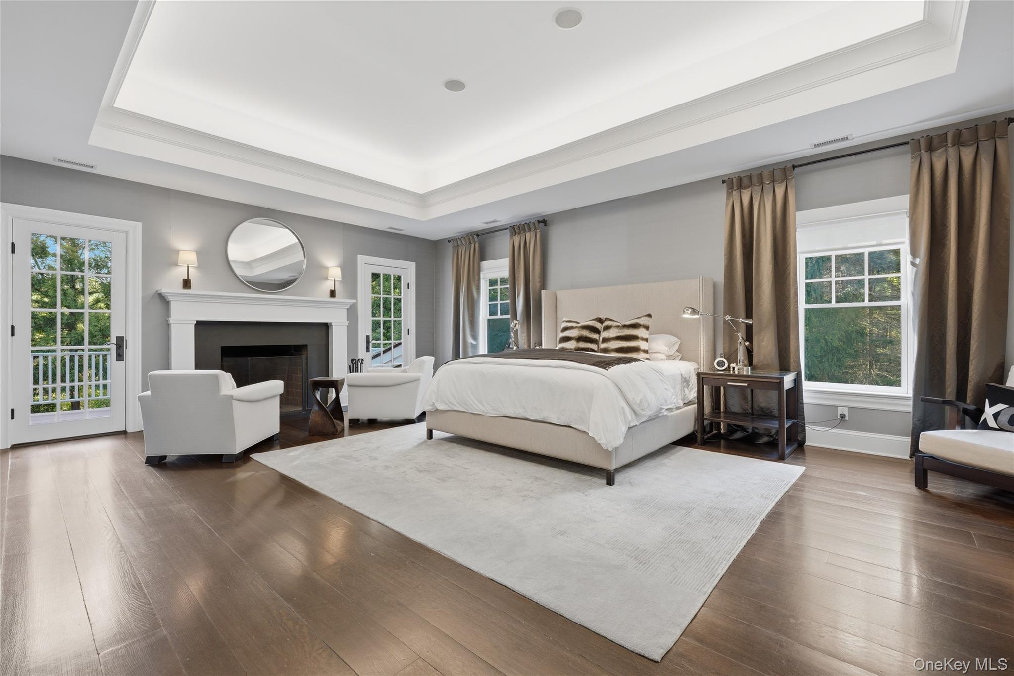16 Wrights Mill Road Armonk, NY 10504 - Photo 31 of 49 a bedroom with a large bed and a fireplace