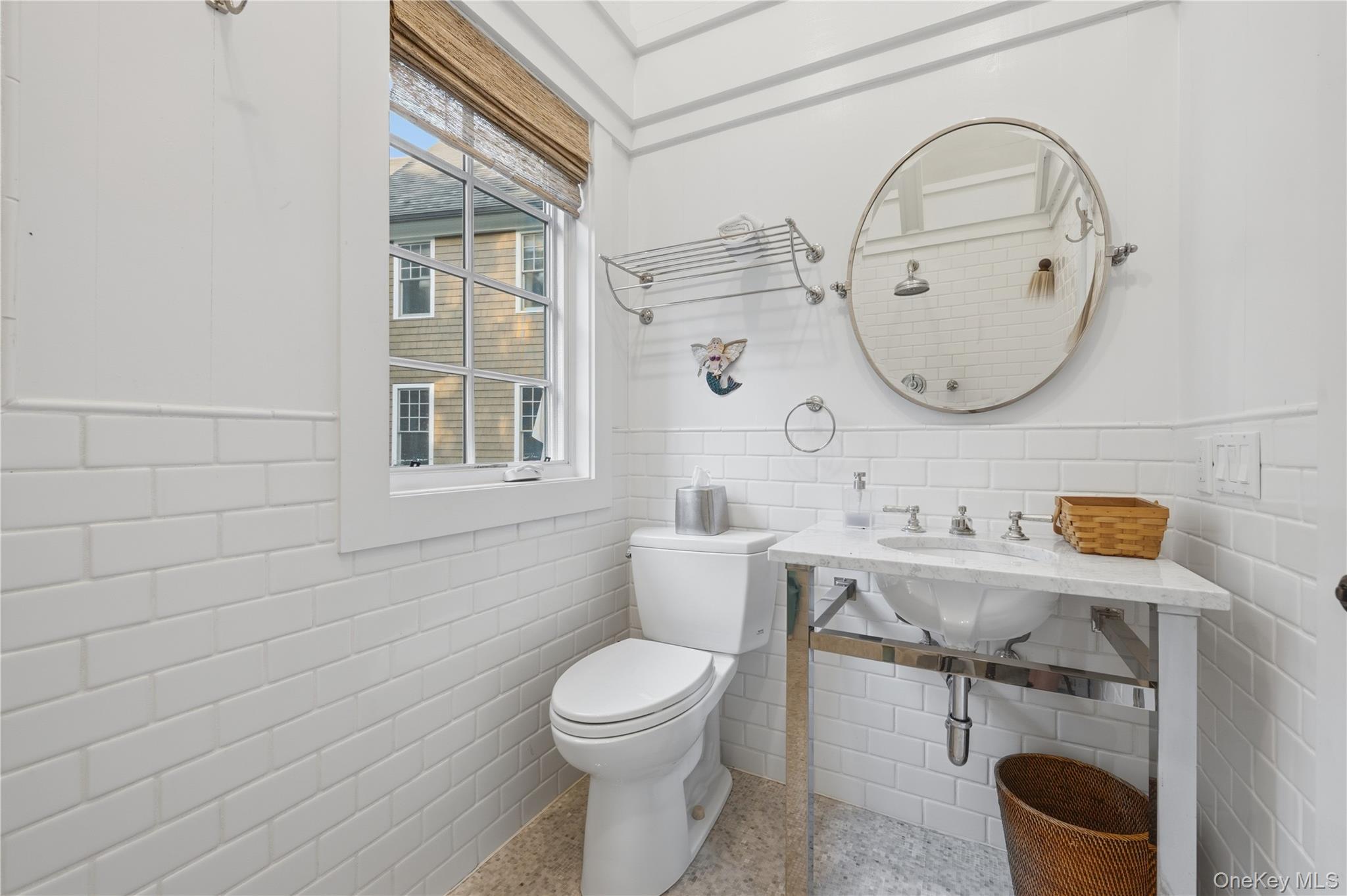 16 Wrights Mill Road Armonk, NY 10504 - Photo 40 of 49 a bathroom with a toilet a sink and mirror