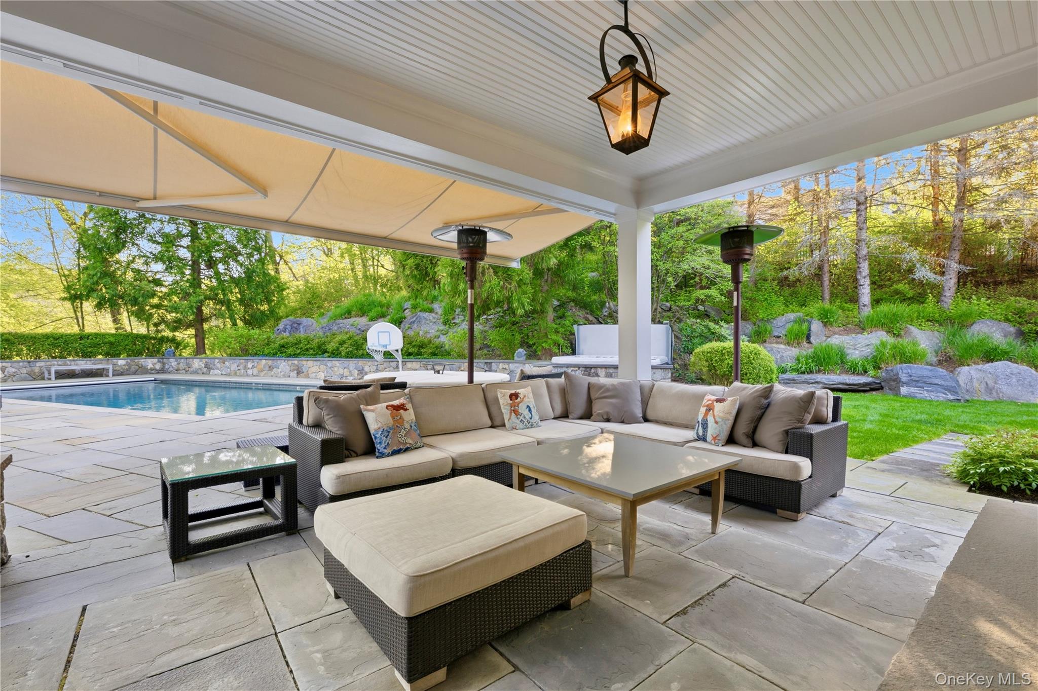 16 Wrights Mill Road Armonk, NY 10504 - Photo 42 of 49 a living room with patio furniture and a garden