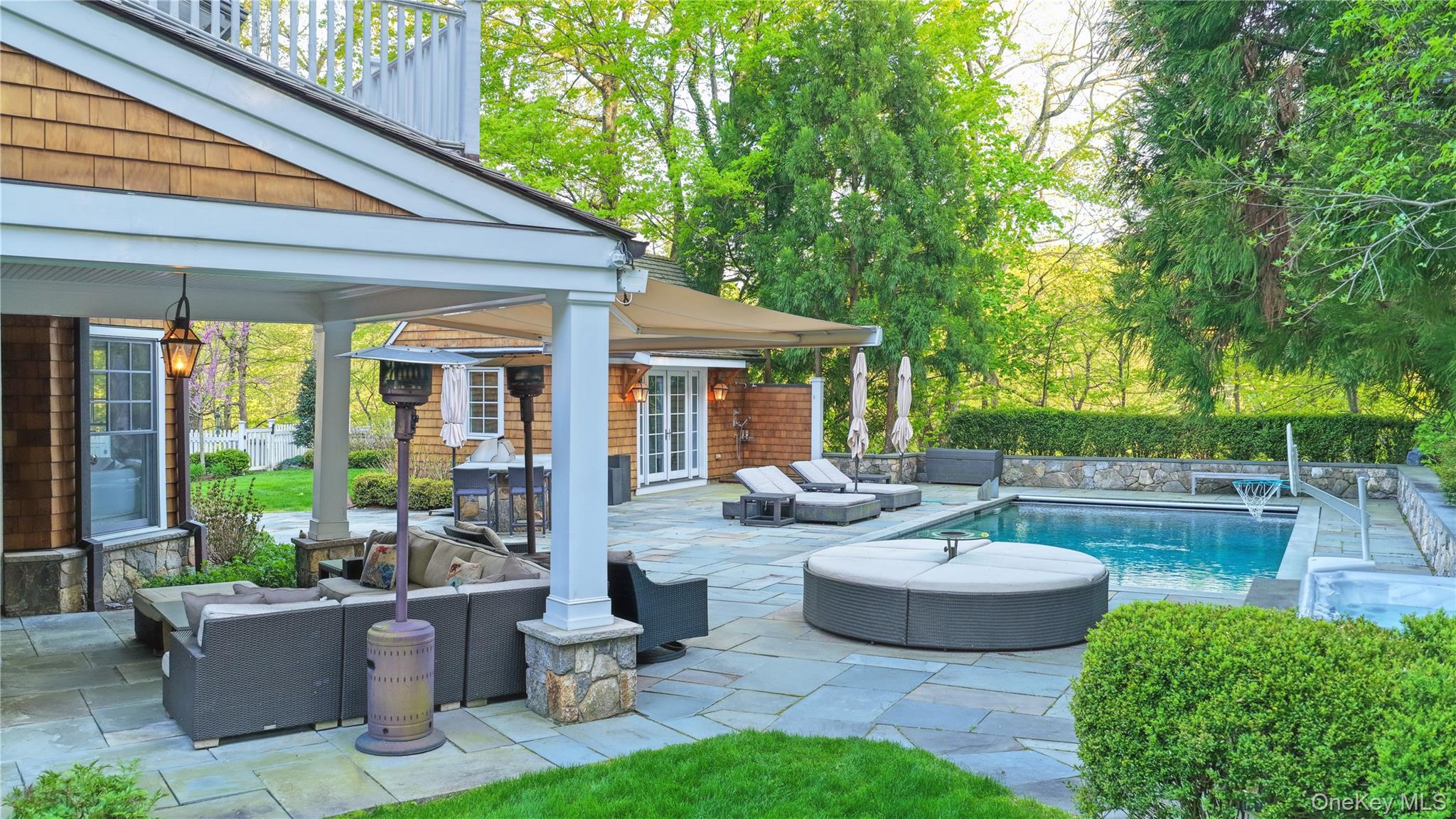 16 Wrights Mill Road Armonk, NY 10504 - Photo 43 of 49 a view of a patio with couches chairs and a potted plant