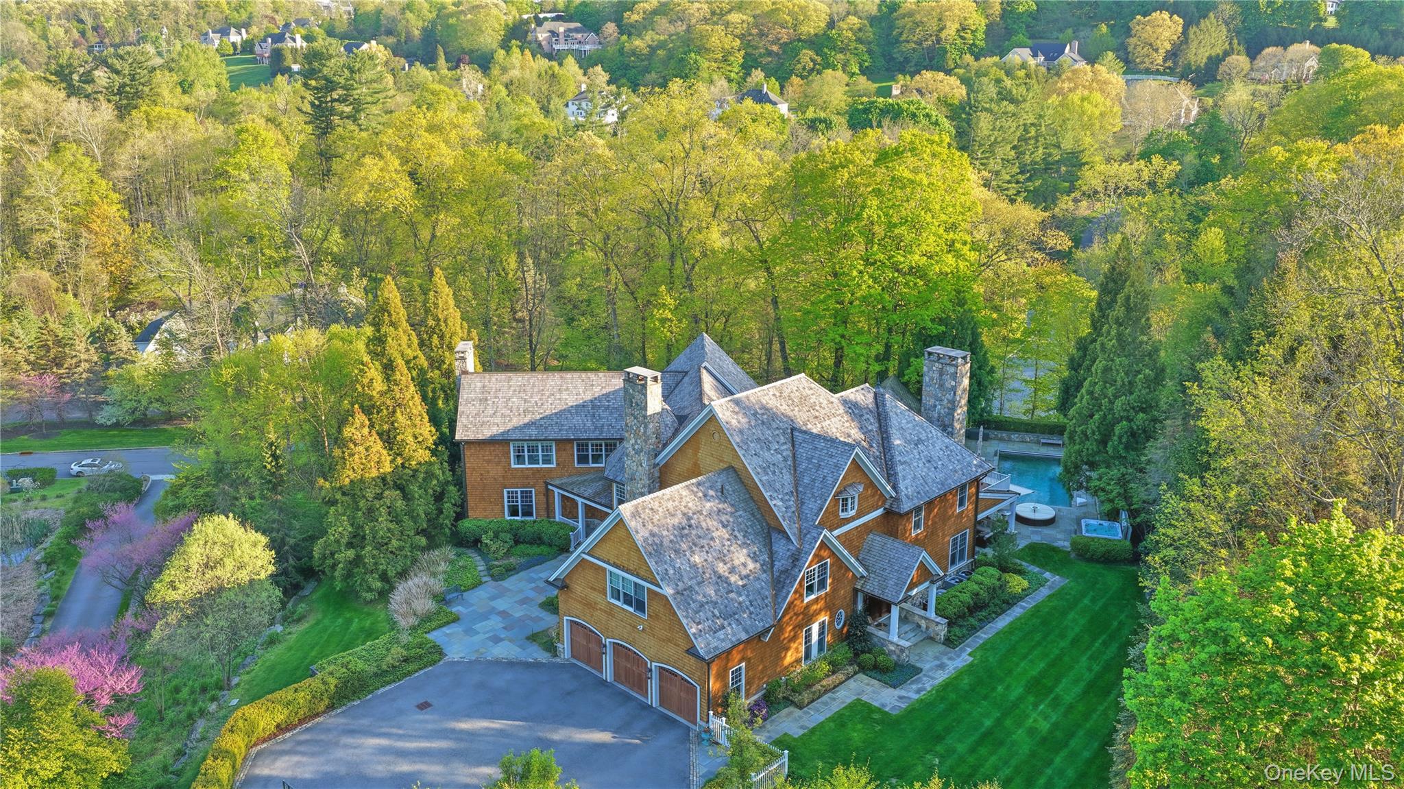 16 Wrights Mill Road Armonk, NY 10504 - Photo 46 of 49 a front view of a house with garden