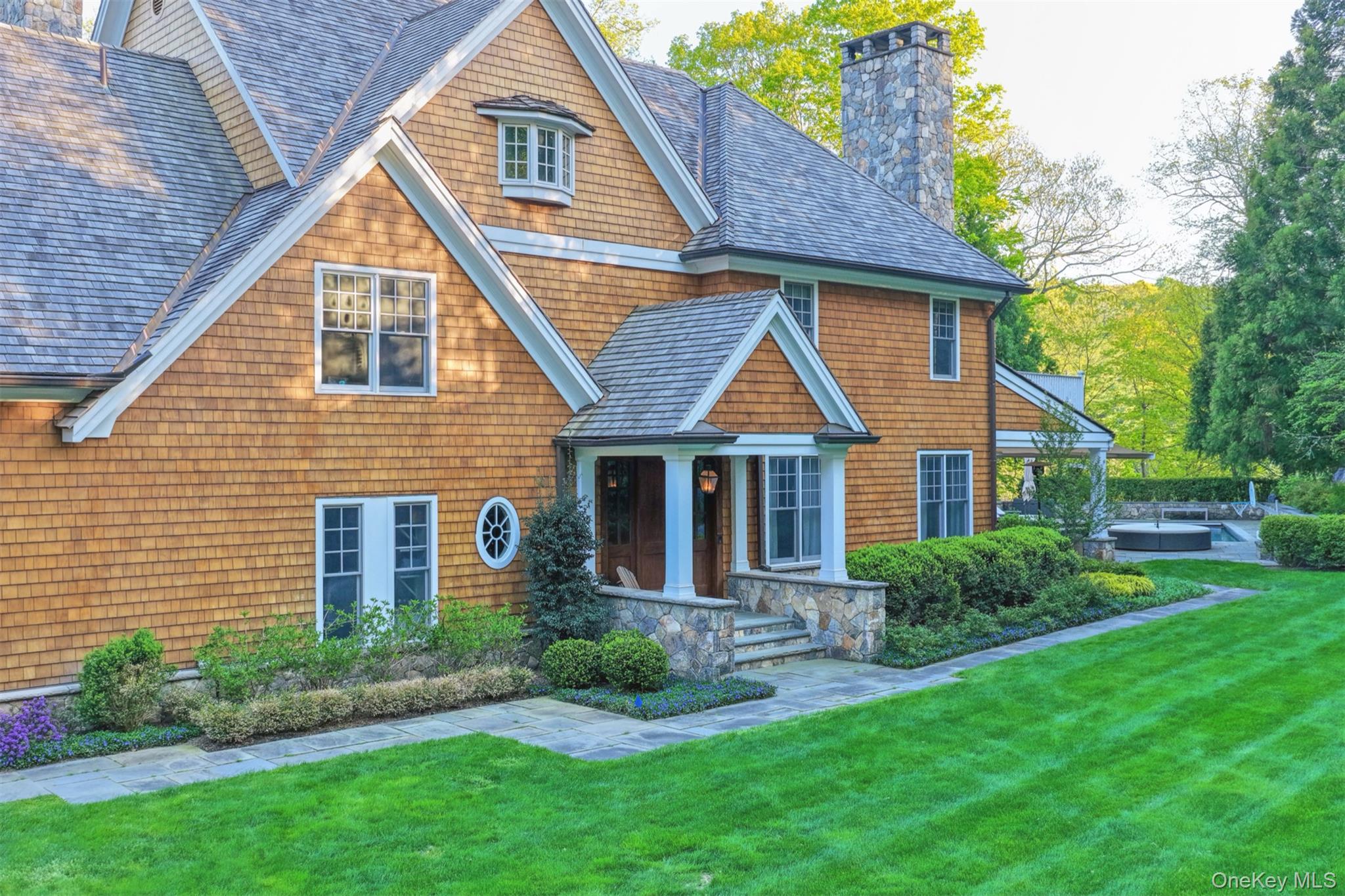 16 Wrights Mill Road Armonk, NY 10504 - Photo 48 of 49 a front view of a house with a yard and porch