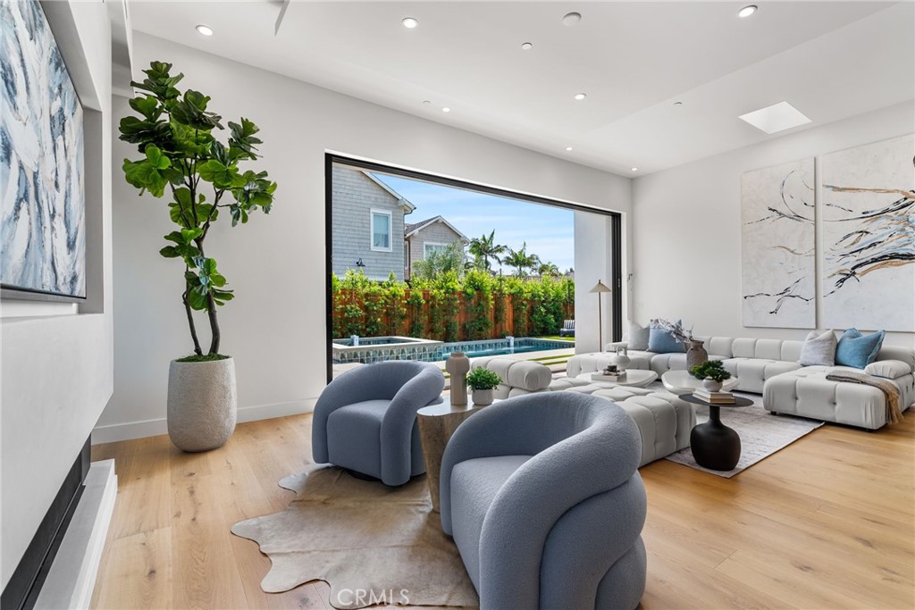 1206 Pembroke Lane Newport Beach, CA 92660 - Photo 17 of 49 a living room with furniture and a large window