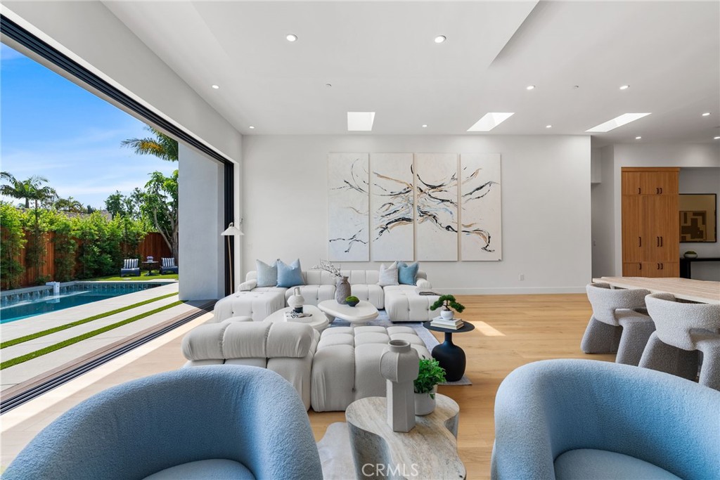 1206 Pembroke Lane Newport Beach, CA 92660 - Photo 18 of 49 a living room with furniture and a large window