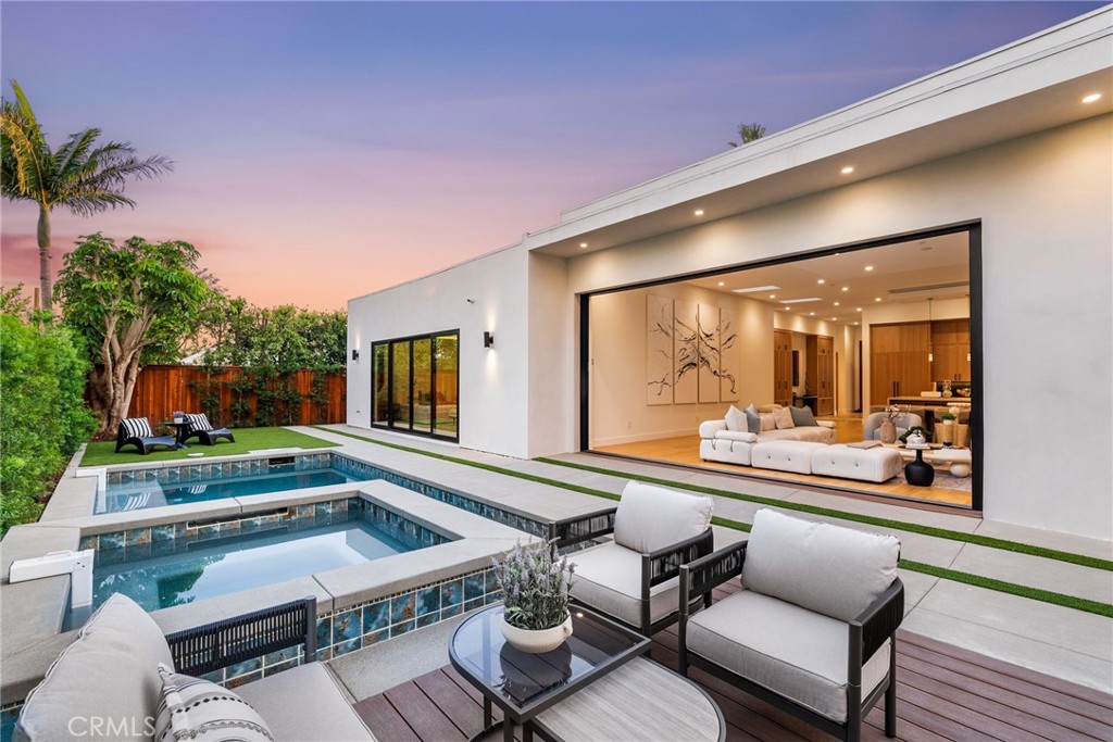 1206 Pembroke Lane Newport Beach, CA 92660 - Photo 19 of 49 a balcony with furniture and a potted plant