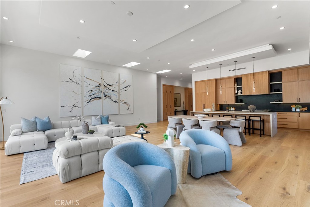 1206 Pembroke Lane Newport Beach, CA 92660 - Photo 22 of 49 a living room with furniture wooden floor and a kitchen view