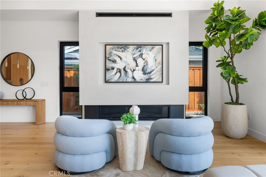 1206 Pembroke Lane Newport Beach, CA 92660 - Photo 24 of 49 a living room with furniture and a potted plant