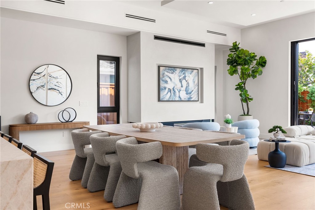 1206 Pembroke Lane Newport Beach, CA 92660 - Photo 26 of 49 a view of a dining room with furniture window and wooden floor