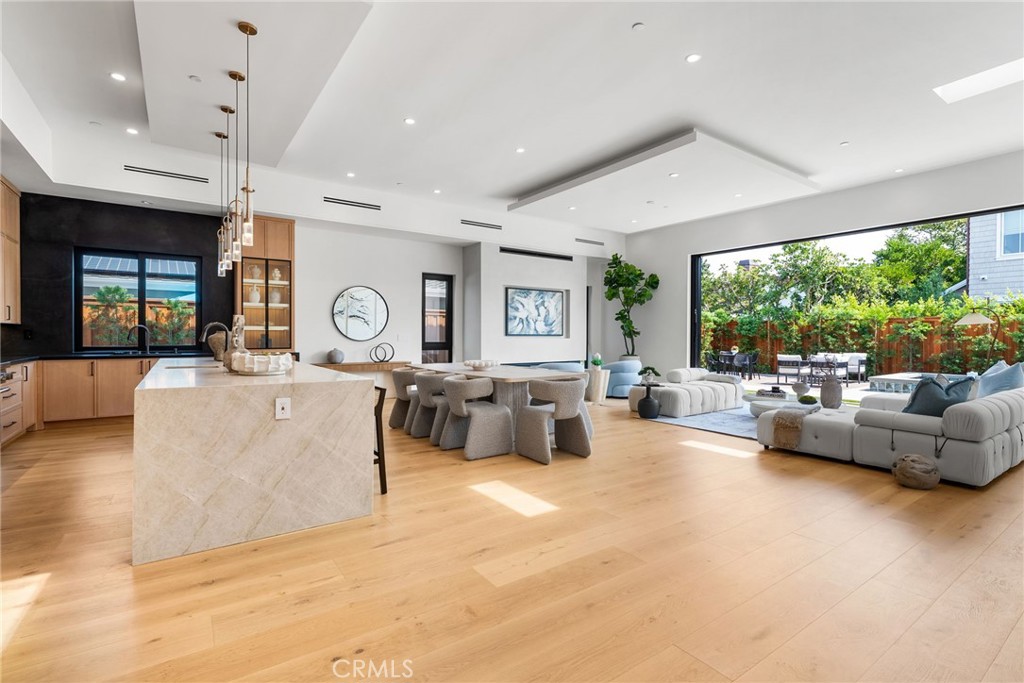 1206 Pembroke Lane Newport Beach, CA 92660 - Photo 27 of 49 a living room with furniture and a large window