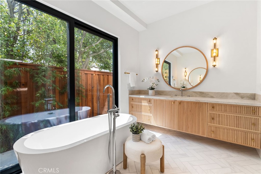 1206 Pembroke Lane Newport Beach, CA 92660 - Photo 32 of 49 a bathroom with a toilet a sink and a mirror