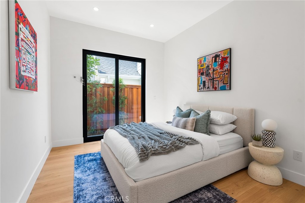 1206 Pembroke Lane Newport Beach, CA 92660 - Photo 37 of 49 a bedroom with a bed and glass window