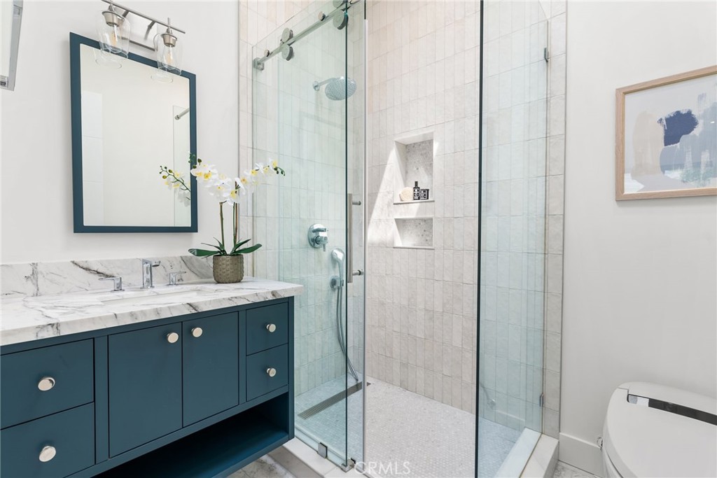 1206 Pembroke Lane Newport Beach, CA 92660 - Photo 38 of 49 a bathroom with a double vanity sink mirror and toilet