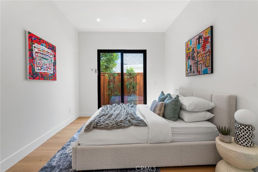 1206 Pembroke Lane Newport Beach, CA 92660 - Photo 39 of 49 a bedroom with a bed and a couch