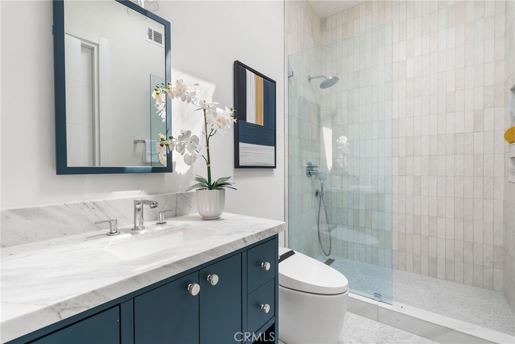 1206 Pembroke Lane Newport Beach, CA 92660 - Photo 40 of 49 a bathroom with a sink a toilet and shower