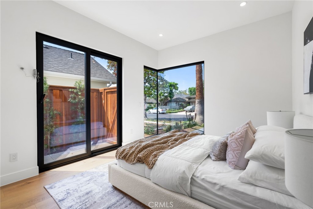 1206 Pembroke Lane Newport Beach, CA 92660 - Photo 41 of 49 a bedroom with a large bed and a large window