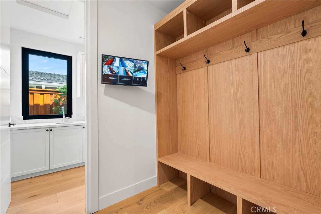 1206 Pembroke Lane Newport Beach, CA 92660 - Photo 44 of 49 a view of a hallway with workspace