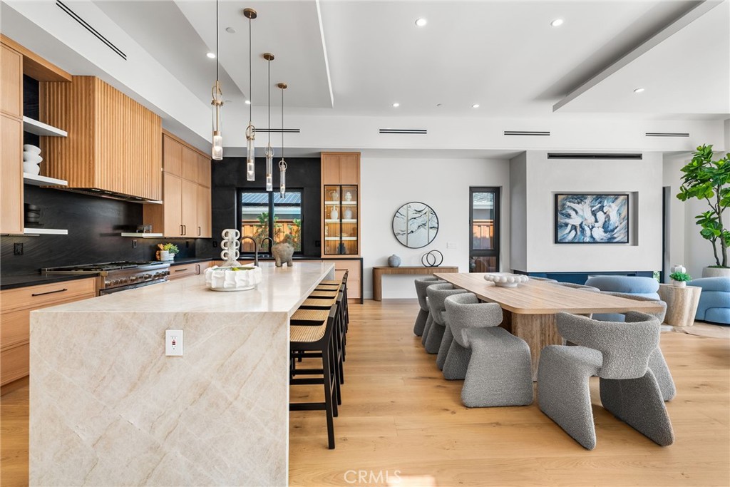 1206 Pembroke Lane Newport Beach, CA 92660 - Photo 7 of 49 a living room with stainless steel appliances kitchen island granite countertop furniture a rug and a window