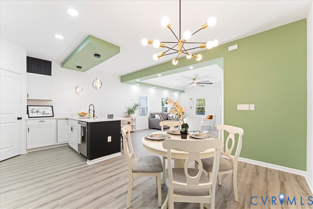 731 Harding Street Petersburg, VA 23803 - Photo 15 of 44 a view of a dining room with furniture and wooden floor