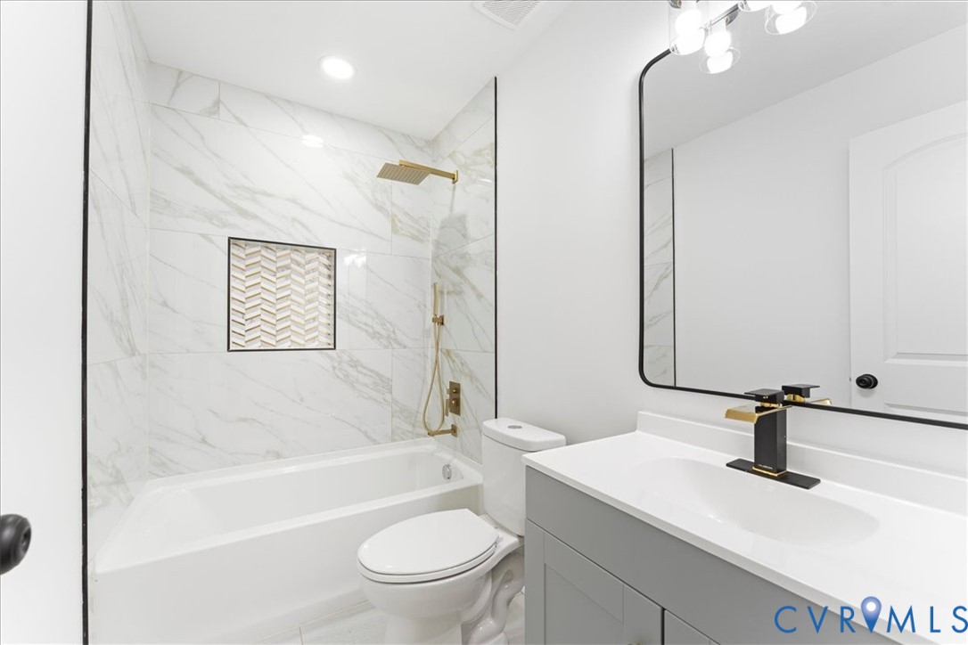 731 Harding Street Petersburg, VA 23803 - Photo 25 of 44 a bathroom with a sink a toilet and shower