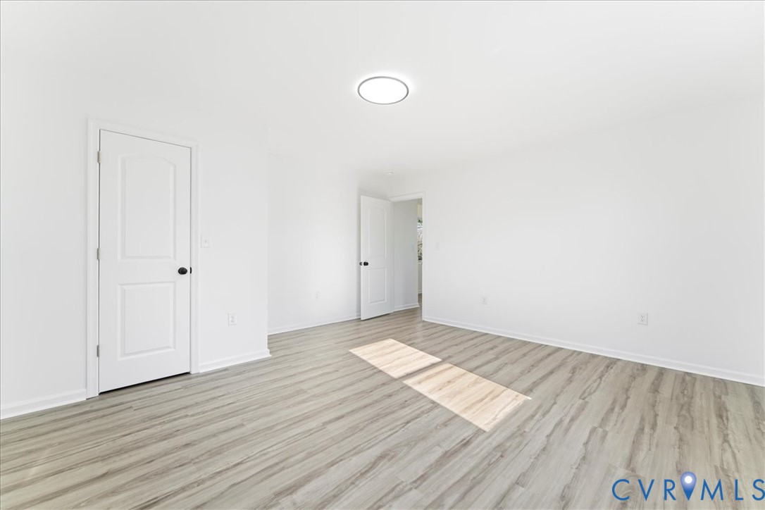 731 Harding Street Petersburg, VA 23803 - Photo 27 of 44 a view of an empty room and wooden floor