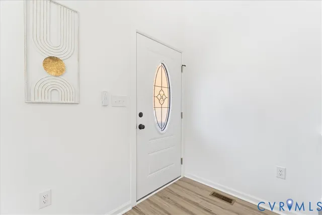 a front view of a house with wooden floor