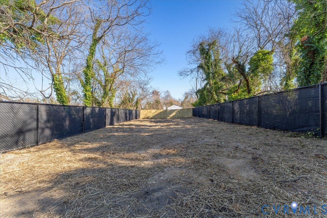 731 Harding Street Petersburg, VA 23803 - Photo 43 of 44 a view of a backyard with wooden fence