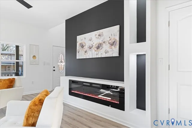 a view of a living room with furniture and a flat screen tv