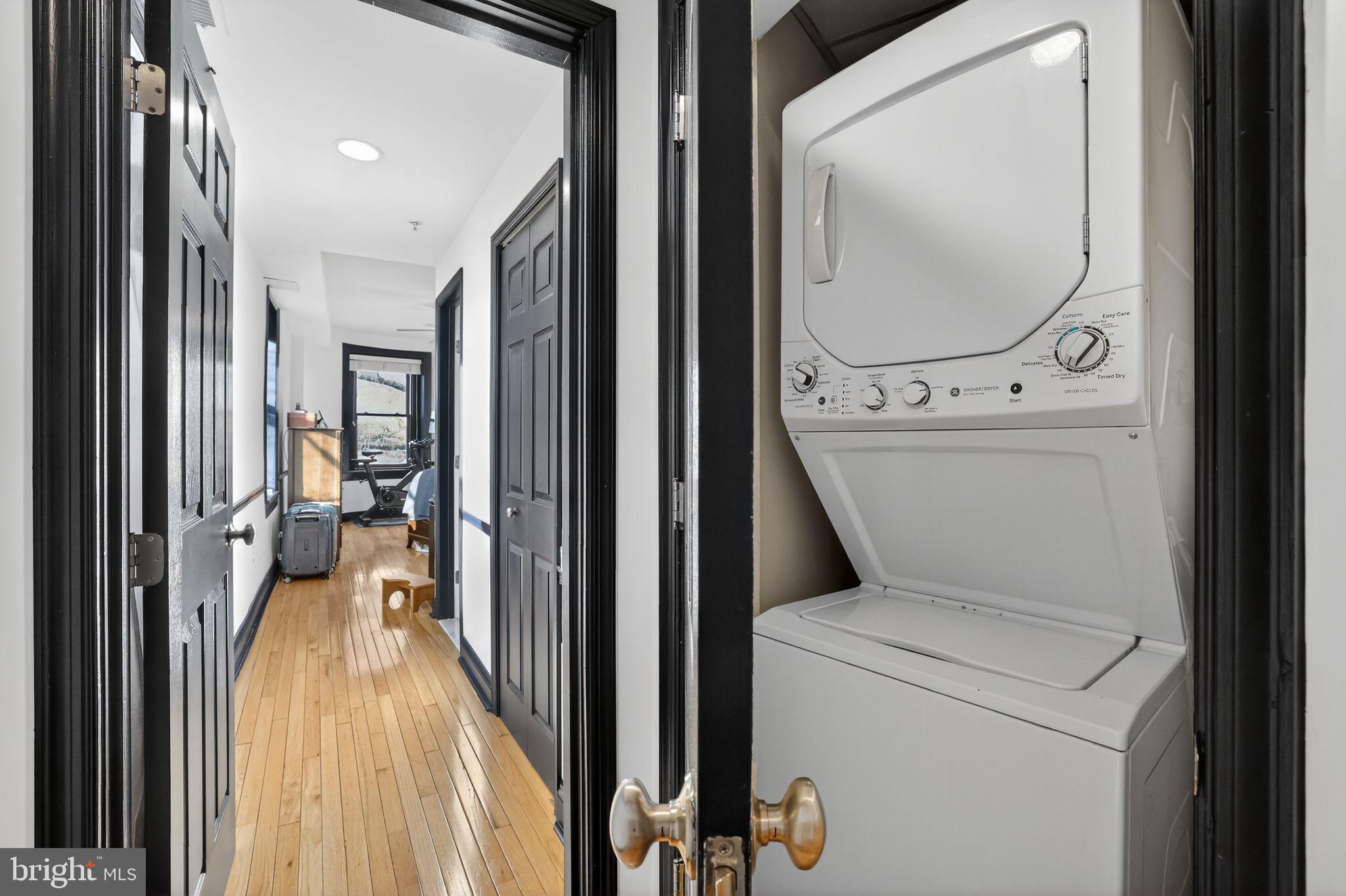 150 Rhode Island Avenue Northwest, Unit 303 Washington, DC 20001 - Photo 12 of 24 a view of a hallway with a washer and dryer